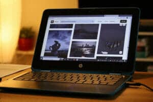 How to factory reset HP laptop—A photo of a black HP laptop open to images