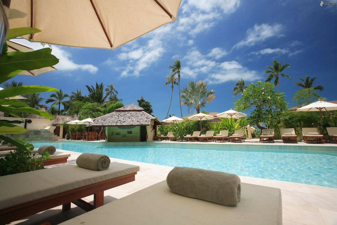 Tropical poolside under umbrella