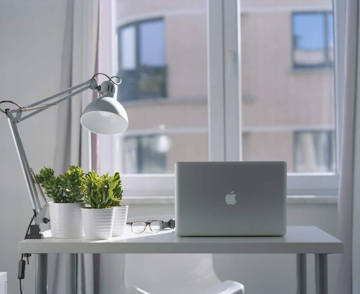 A home workspace with a desk by the window