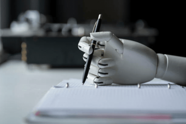 A robotic hand is writing an AI prompt